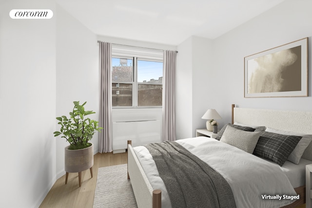 bedroom with light hardwood / wood-style flooring