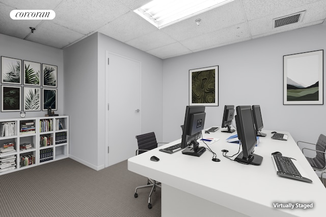 carpeted office with a drop ceiling and visible vents