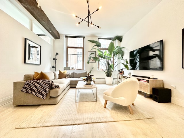 living room with wood-type flooring and a notable chandelier