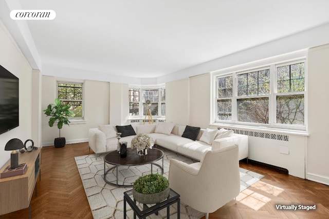 living room featuring parquet floors