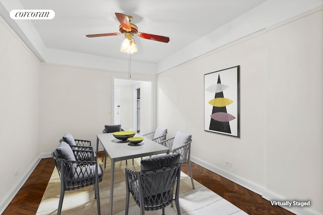 dining room with parquet flooring and ceiling fan