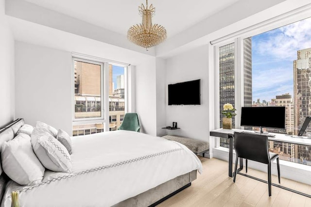 bedroom with light hardwood / wood-style floors