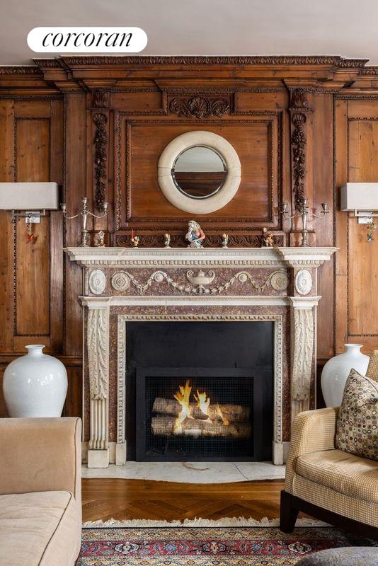 living room with hardwood / wood-style floors, a chandelier, and ornamental molding