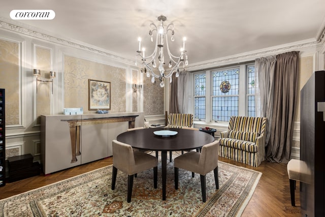 dining room featuring a chandelier, crown molding, and parquet floors