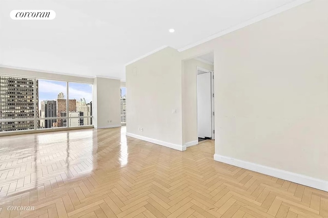 845 1st Ave Unit 42E, New York City, NY 10017 - empty room featuring baseboards, crown molding, a view of city, and recessed lighting