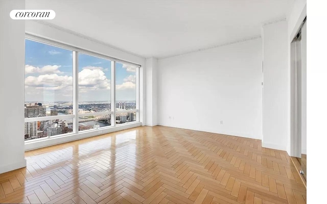 spare room with visible vents and a city view