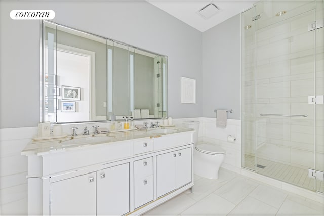 bathroom featuring vanity, tile walls, an enclosed shower, and toilet