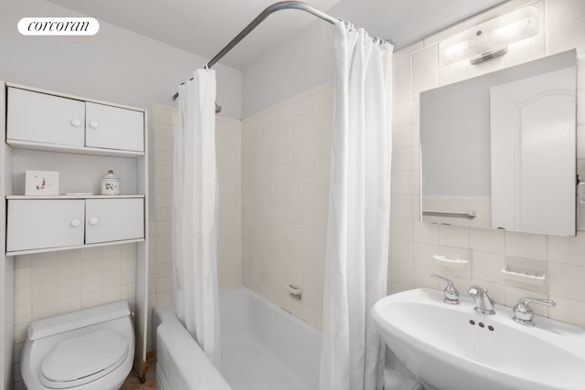 bathroom featuring a sink, visible vents, tile walls, backsplash, and shower / bath combination with curtain