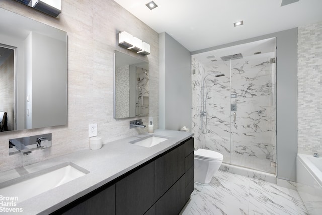 bathroom with a shower with shower door, vanity, and toilet