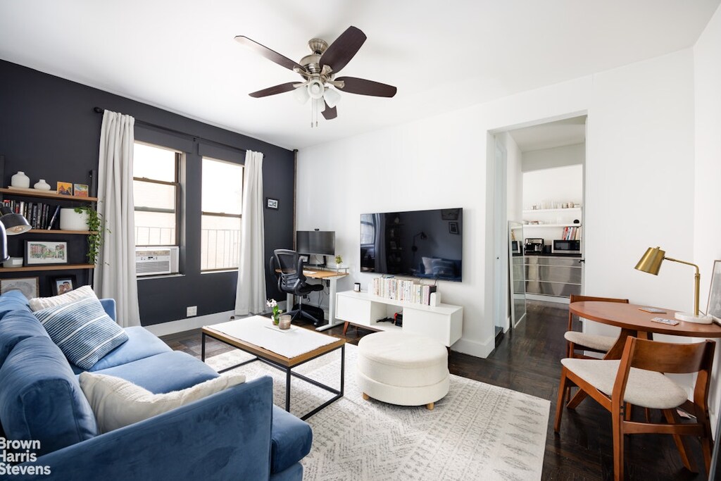 67 Morton St Unit 5B, New York City, NY 10014 - living room featuring baseboards, cooling unit, dark wood finished floors, and ceiling fan