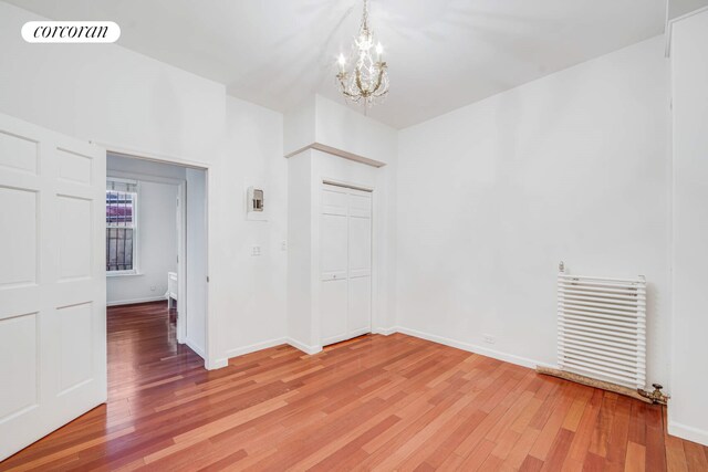 dining area with hardwood / wood-style flooring and ornamental molding