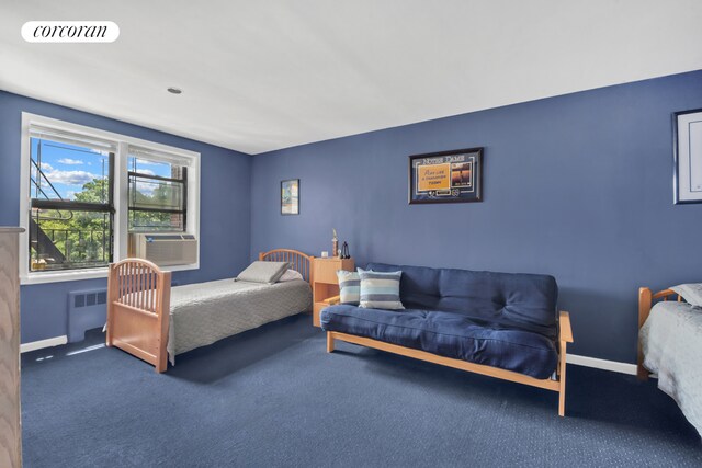 72-11 110th St Unit 3B, New York City, NY 11375 - carpeted bedroom with radiator, baseboards, and cooling unit