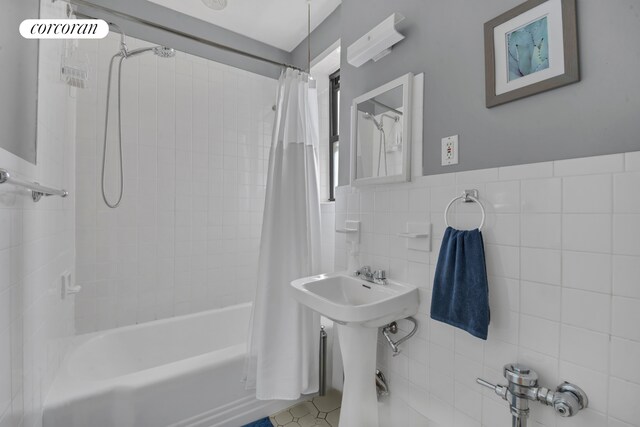 72-11 110th St Unit 3B, New York City, NY 11375 - bathroom with tile walls, shower / bath combination with curtain, and wainscoting