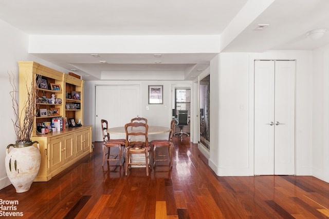 dining room with dark wood-type flooring