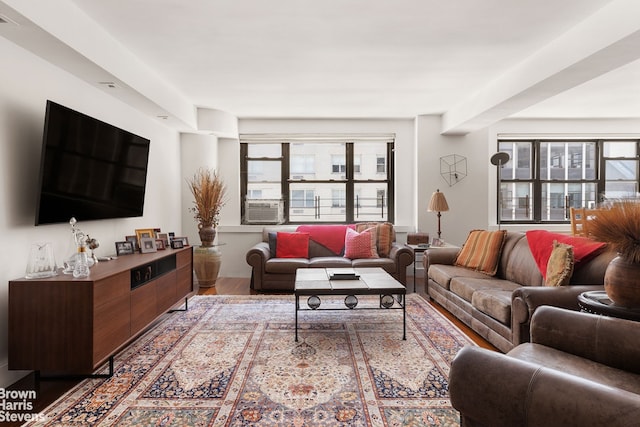 living room featuring cooling unit and hardwood / wood-style floors