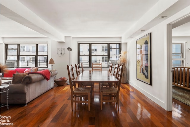 dining space with cooling unit and dark hardwood / wood-style floors