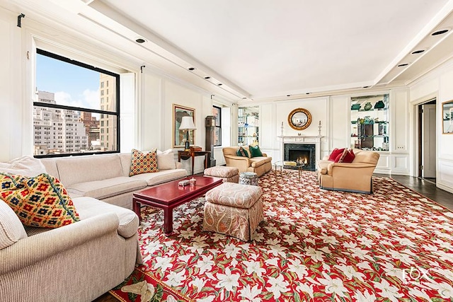 living room featuring a high end fireplace