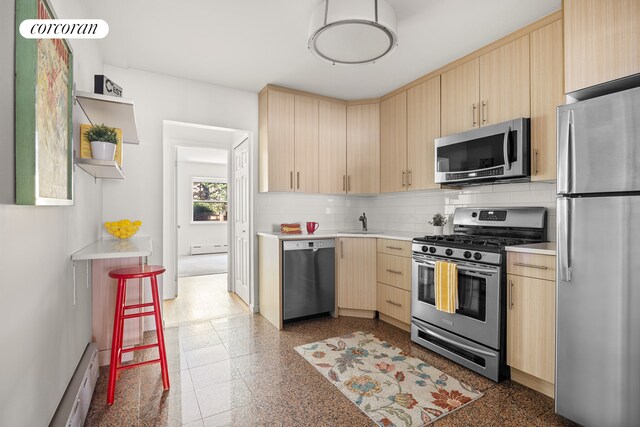 dining space featuring a wall mounted AC and light hardwood / wood-style flooring