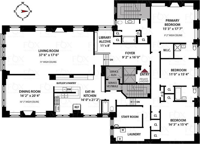 carpeted bedroom featuring a premium fireplace and beam ceiling