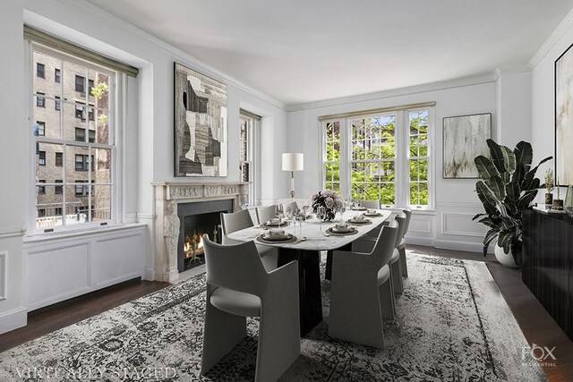 kitchen with sink, a breakfast bar area, white cabinets, a kitchen island with sink, and stainless steel appliances