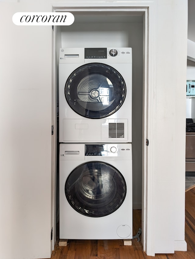 54 W 71st Street Building, New York City, NY 10023 - laundry area with stacked washer / dryer and wood finished floors