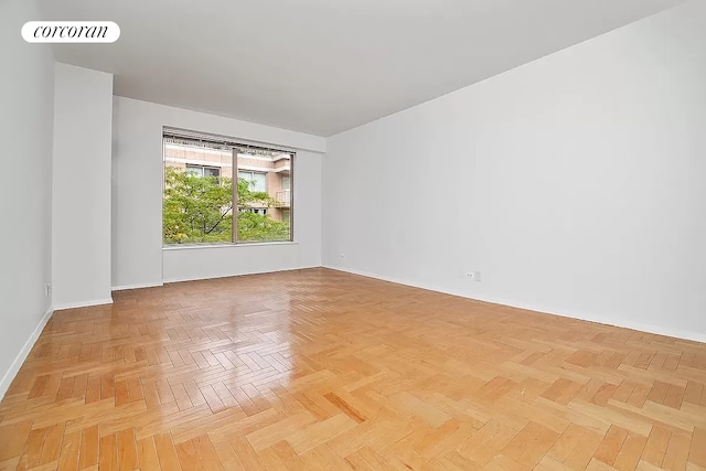 unfurnished room with visible vents and baseboards