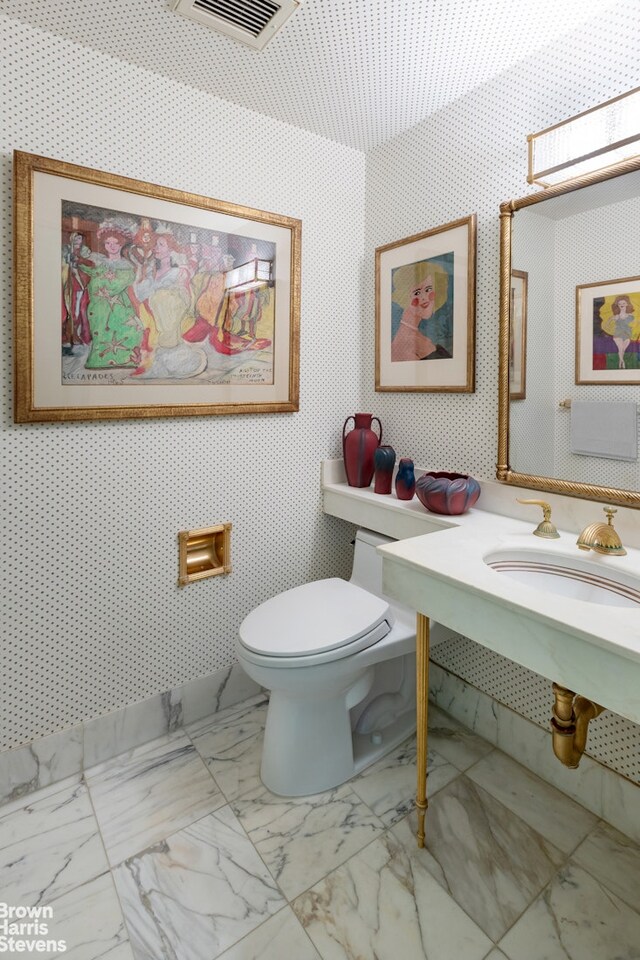 bathroom featuring sink and toilet