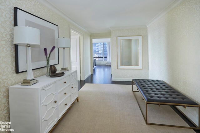 hallway featuring ornamental molding and dark hardwood / wood-style floors