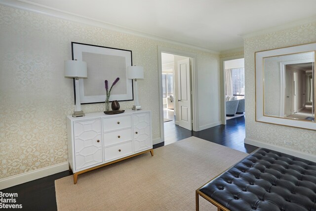 bedroom featuring crown molding and dark hardwood / wood-style floors