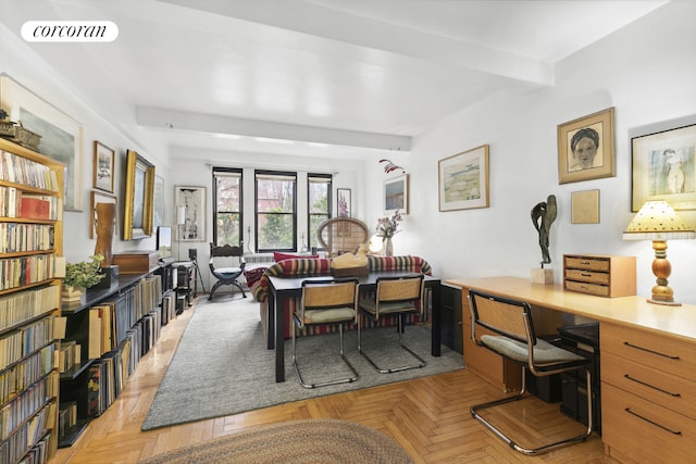 dining space with light parquet floors, built in desk, and beamed ceiling