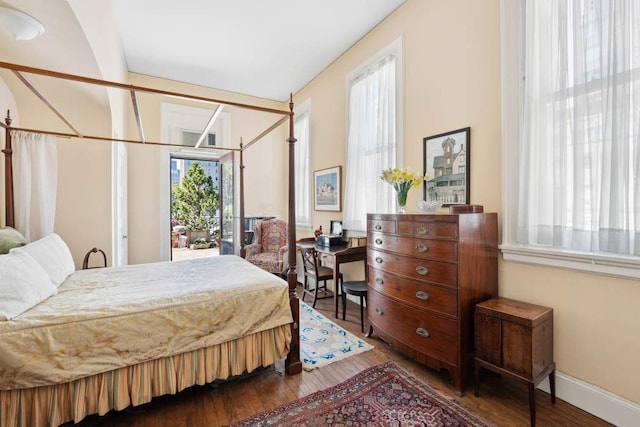 bedroom with hardwood / wood-style flooring