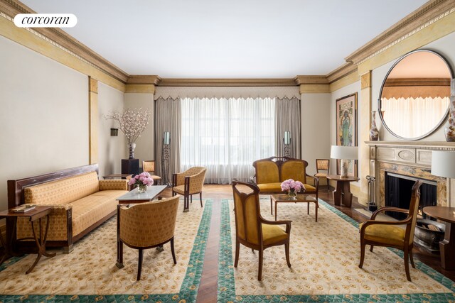 49 E 80th St, New York City, NY 10075 - sitting room featuring crown molding, wood finished floors, a high end fireplace, and visible vents