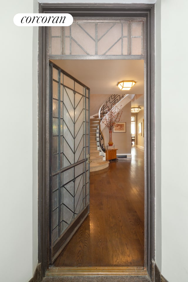 49 E 80th St, New York City, NY 10075 - hall with wood finished floors, baseboards, and stairway