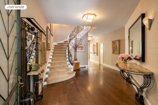 49 E 80th St, New York City, NY 10075 - foyer entrance with wood finished floors, baseboards, and stairs