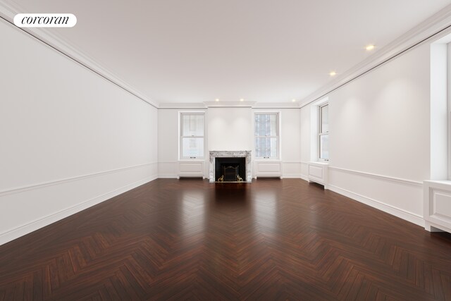 470 Park Ave Unit 5C, New York City, NY 10022 - unfurnished living room featuring a fireplace, ornamental molding, baseboards, and recessed lighting