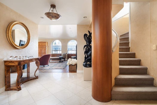 stairs featuring tile patterned flooring