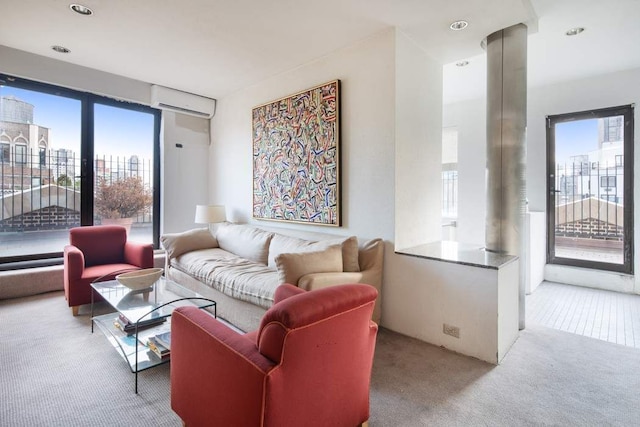 carpeted living room featuring a wall unit AC