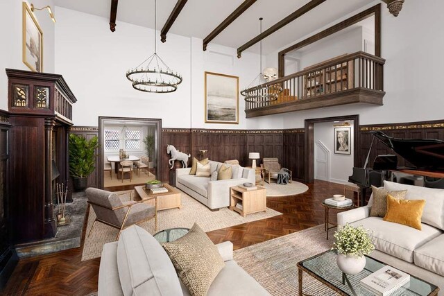 33 W 67th St Unit 6Fe, New York City, NY 10023 - living room with a chandelier, beam ceiling, a high ceiling, and a wainscoted wall