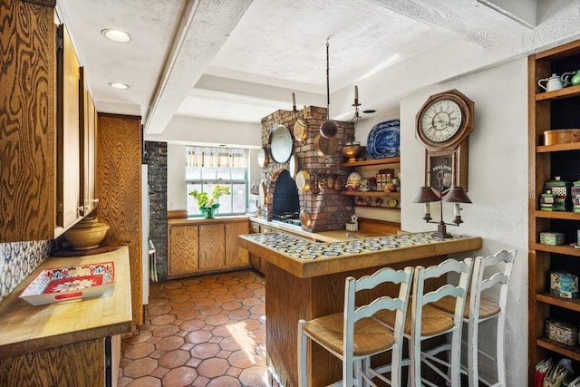 dining room with a chandelier and beamed ceiling