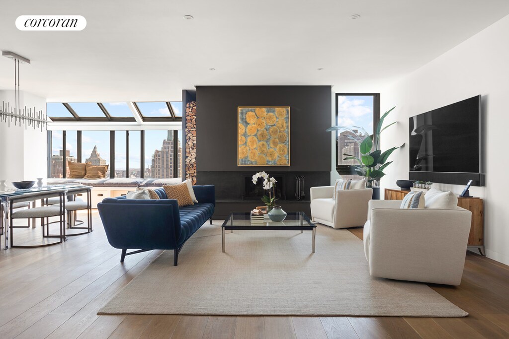 living room with a view of city, hardwood / wood-style floors, and visible vents