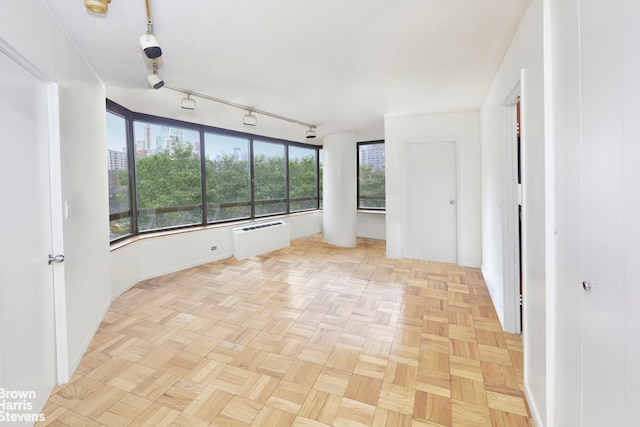 empty room with light parquet floors