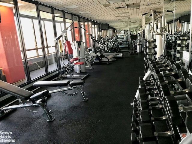 exercise room with floor to ceiling windows