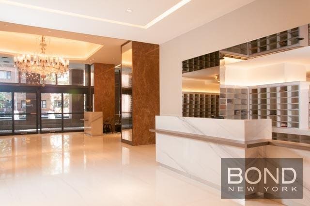 reception area featuring a notable chandelier