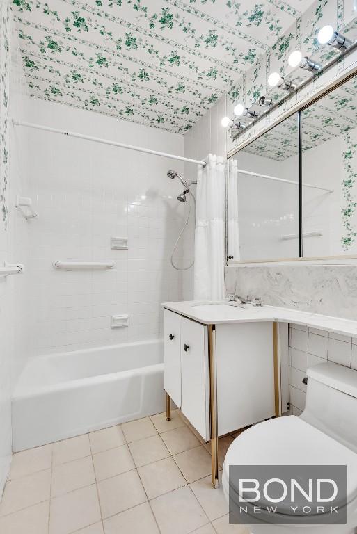 full bathroom with tile patterned flooring, vanity, shower / bath combination with curtain, and toilet