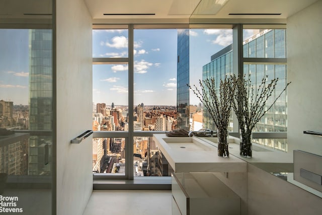 living room featuring light hardwood / wood-style floors and floor to ceiling windows