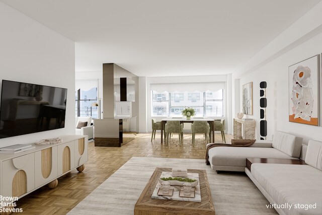 living room with light parquet floors and plenty of natural light