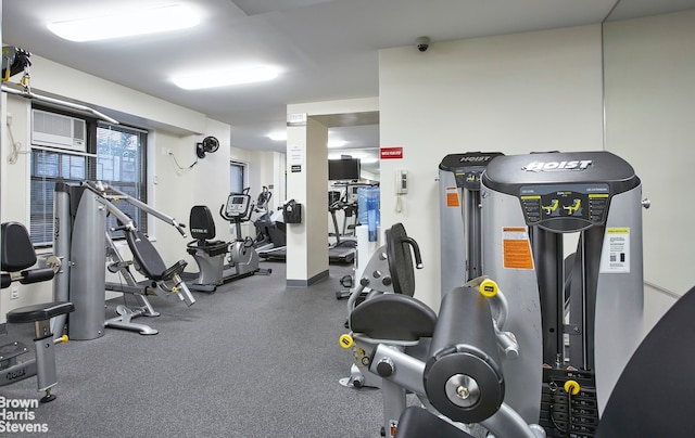 workout area with an AC wall unit