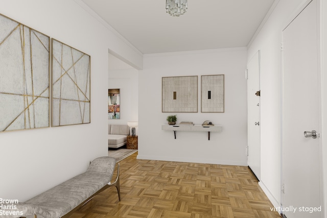 hallway featuring ornamental molding and light parquet flooring