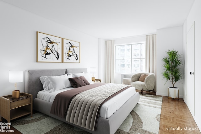 bedroom featuring light parquet floors