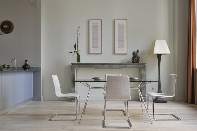 living room featuring light wood-type flooring and a healthy amount of sunlight